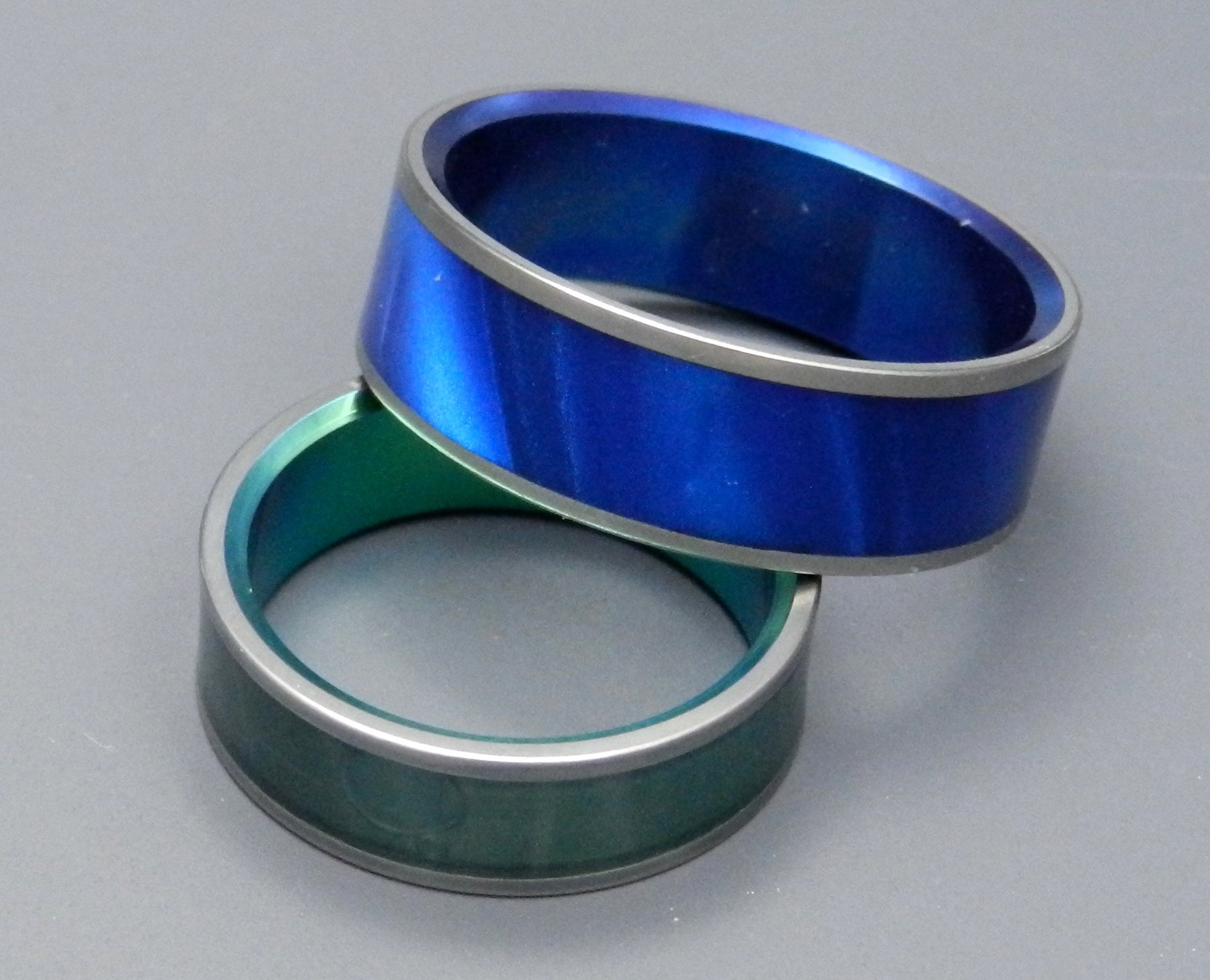 MIDNIGHT & SEA MOSS | Blue & Green Marbled Opalescent Resin - His &Hers Titanium Wedding Band Set - Minter and Richter Designs