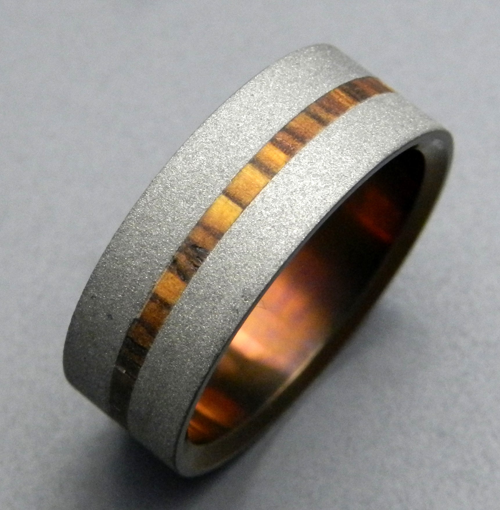 STRONG HEART | Cocobolo Wood & Hand Anodized Titanium Wedding Rings - Minter and Richter Designs